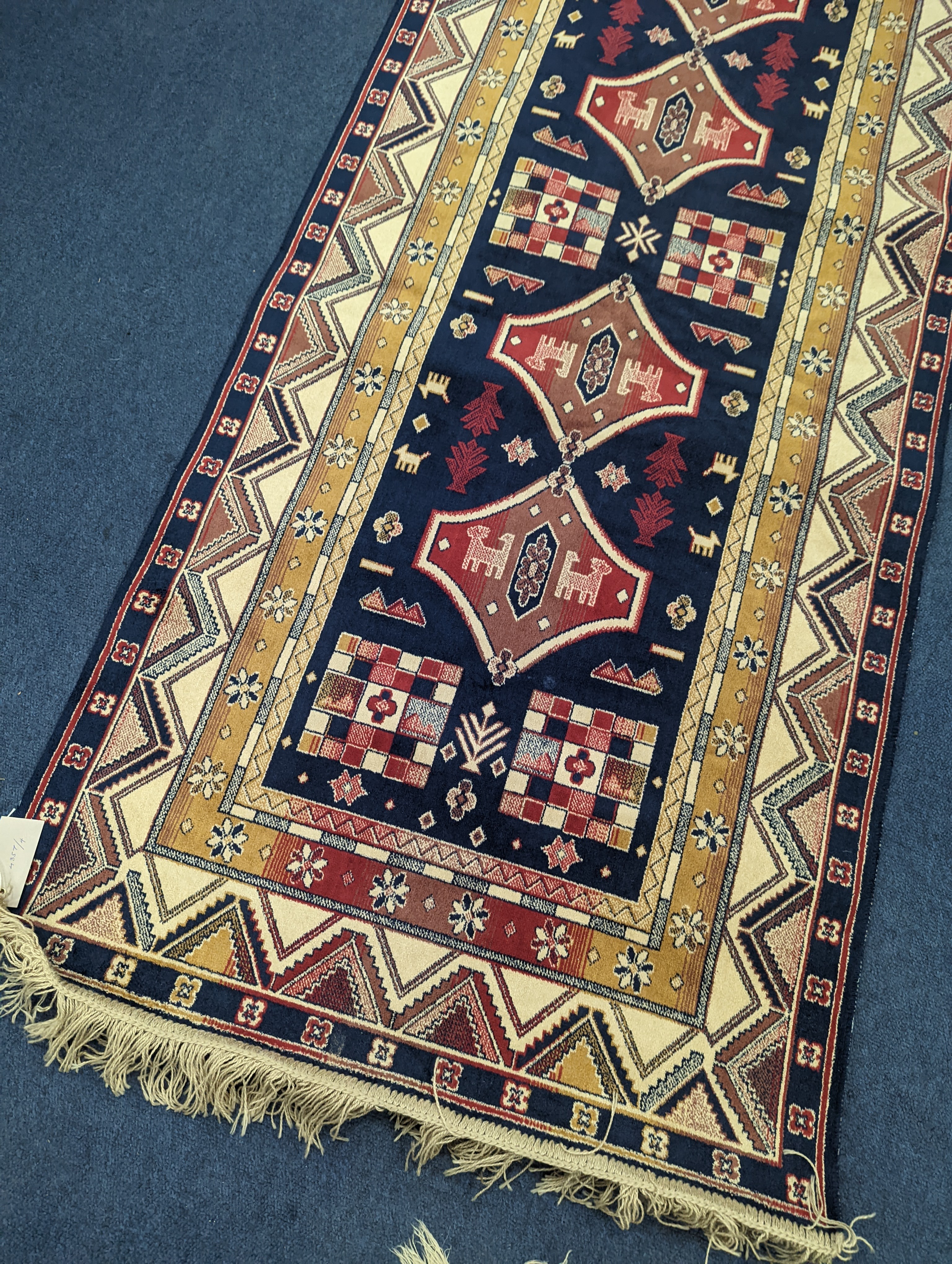 A small Caucasian style runner, 230 x 69cm